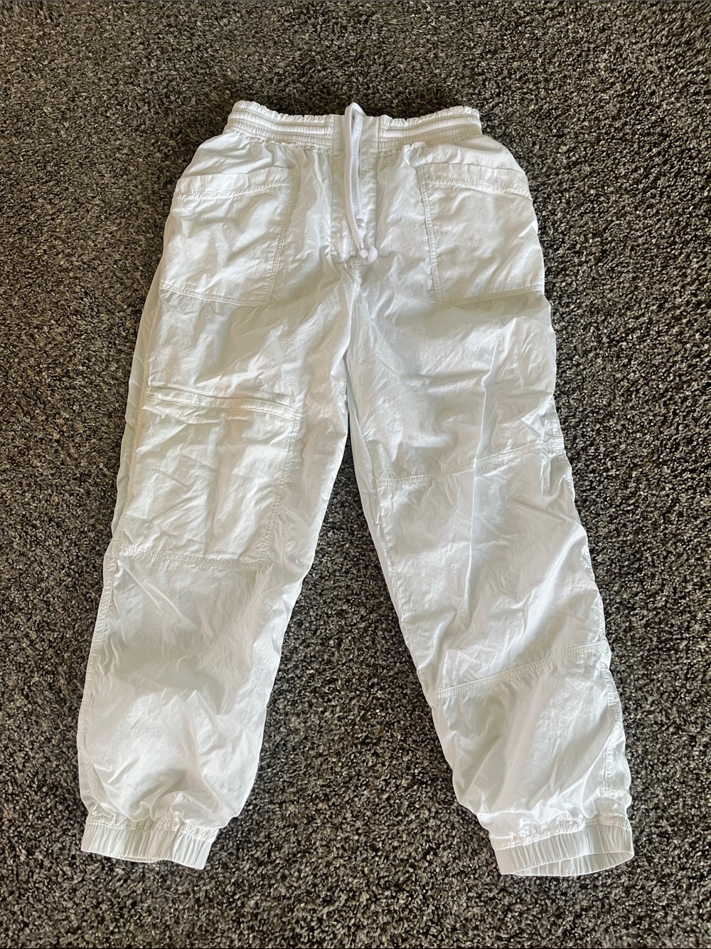 FREE PEOPLE MOVEMENT white lined nylon pants with lots of pockets